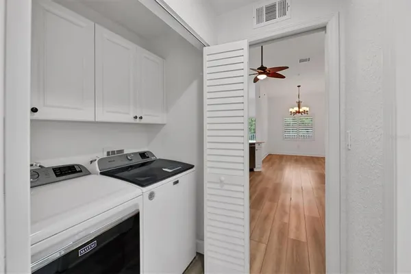 a view of a hallway with a white walls