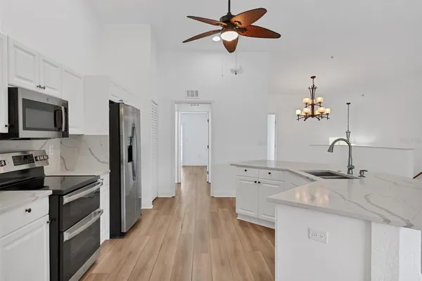 a kitchen with a stove and a microwave