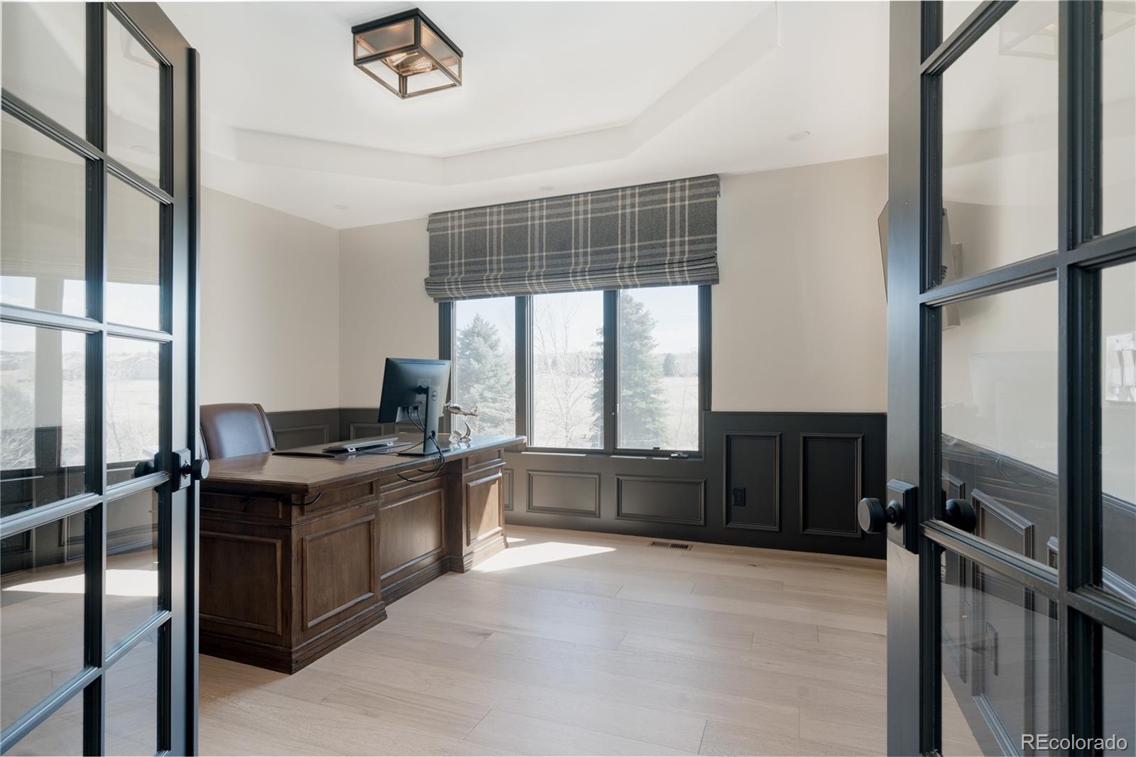298 Fairchild Drive Highlands Ranch, CO 80126 - Photo 15 of 50 a kitchen with a counter top space appliances and windows