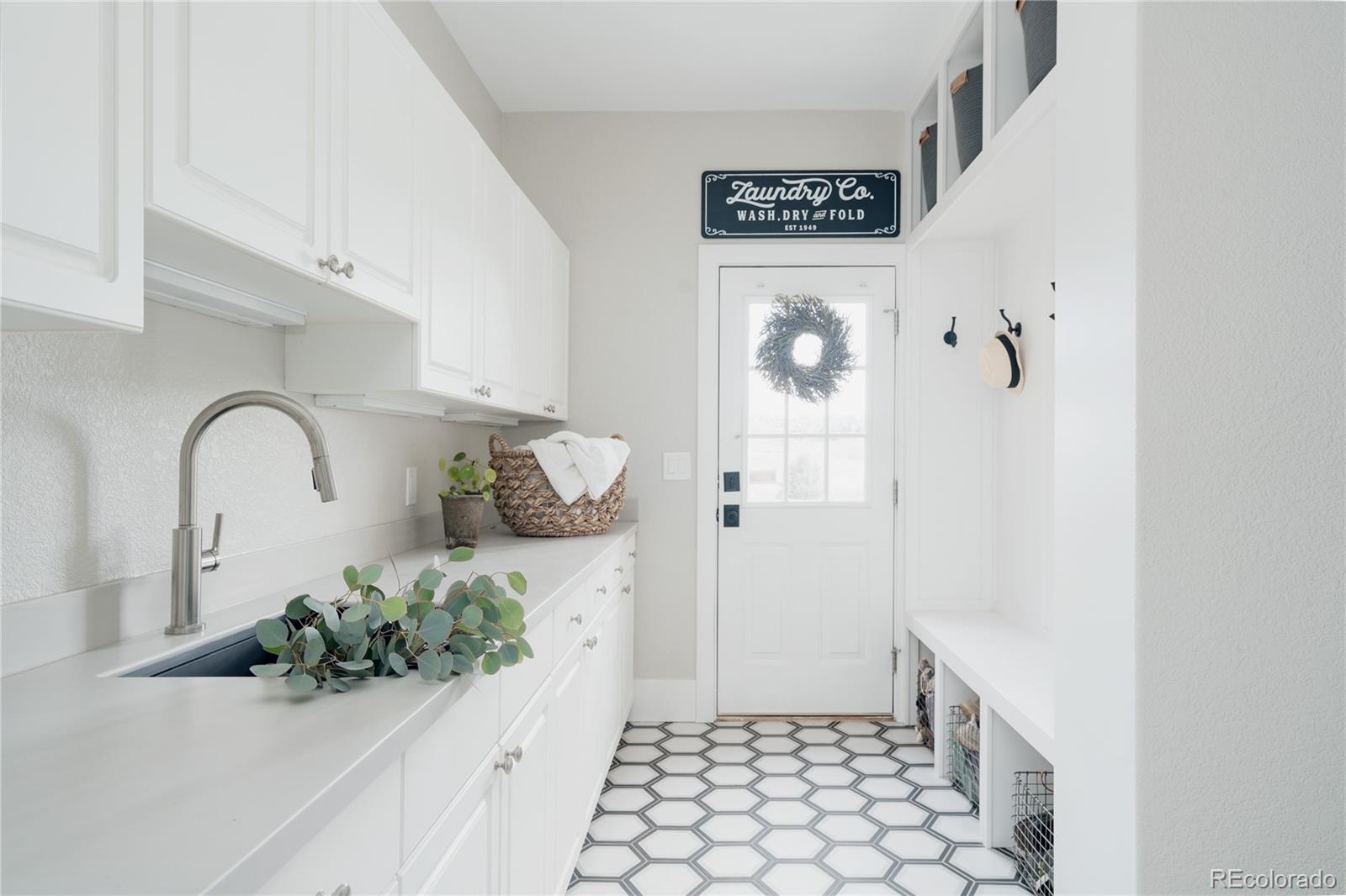 298 Fairchild Drive Highlands Ranch, CO 80126 - Photo 17 of 50 a bathroom with a sink and mirror