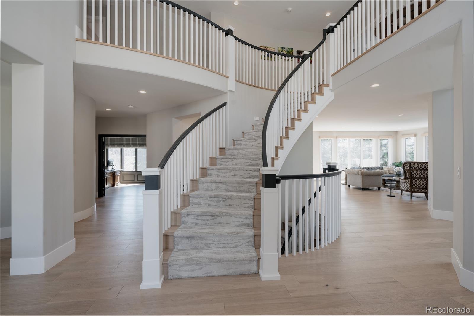 298 Fairchild Drive Highlands Ranch, CO 80126 - Photo 2 of 50 a view of entryway and hall with wooden floor