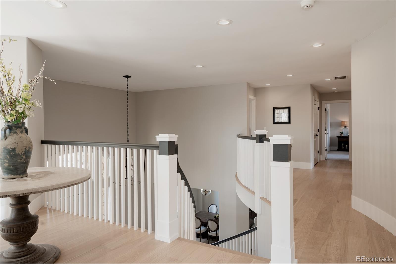 298 Fairchild Drive Highlands Ranch, CO 80126 - Photo 27 of 50 a view of entryway and hall with wooden floor