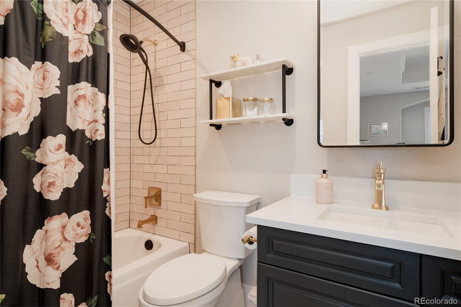 298 Fairchild Drive Highlands Ranch, CO 80126 - Photo 29 of 50 a bathroom with a sink toilet and shower