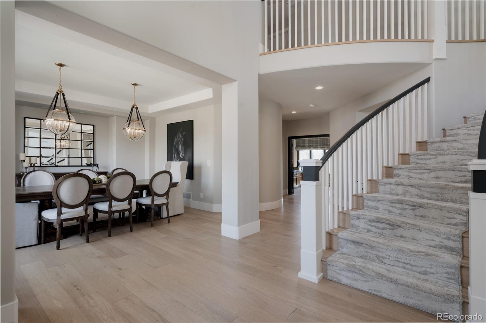 298 Fairchild Drive Highlands Ranch, CO 80126 - Photo 3 of 50 a view of a hallway with seating space and stairs