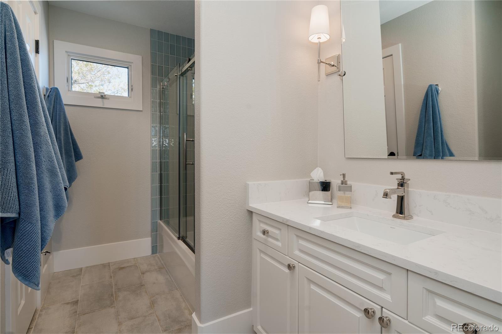 298 Fairchild Drive Highlands Ranch, CO 80126 - Photo 33 of 50 a bathroom with a sink and a mirror
