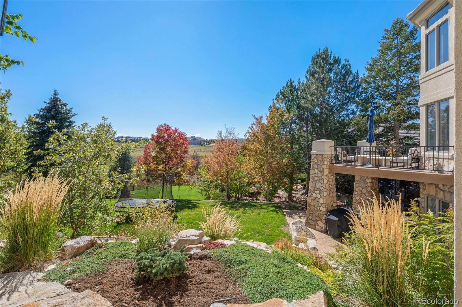 298 Fairchild Drive Highlands Ranch, CO 80126 - Photo 38 of 50 a view of a town with large trees