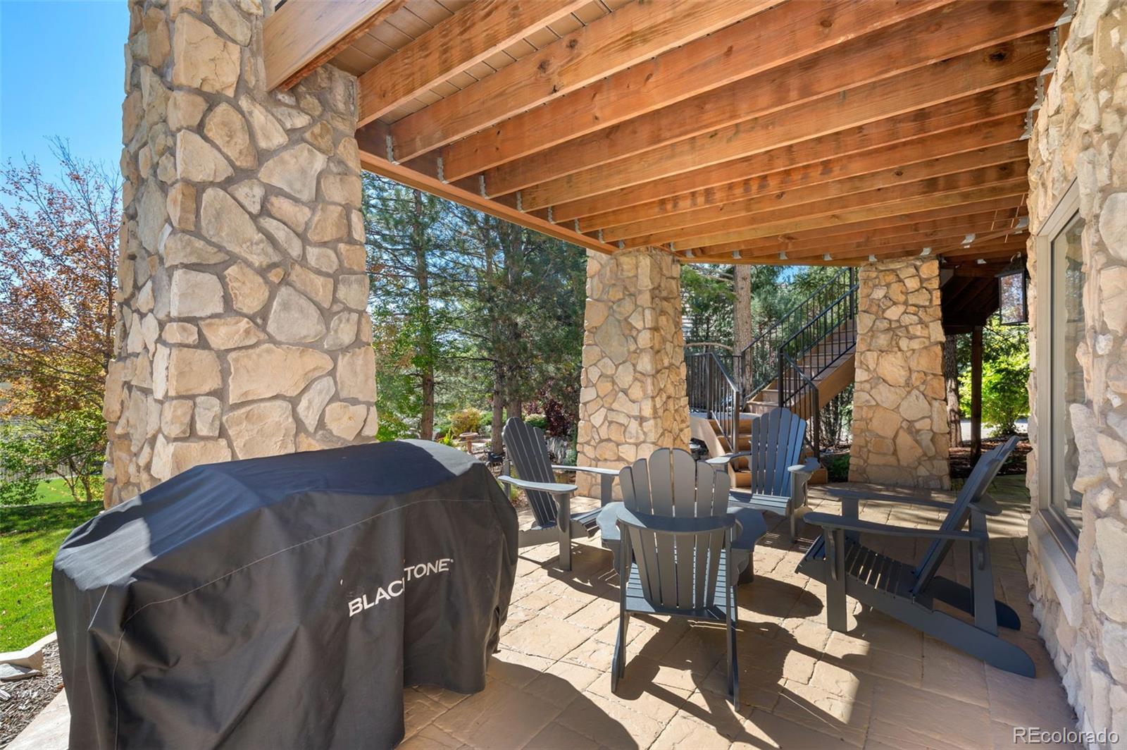 298 Fairchild Drive Highlands Ranch, CO 80126 - Photo 42 of 50 a outdoor living space with furniture and garden view
