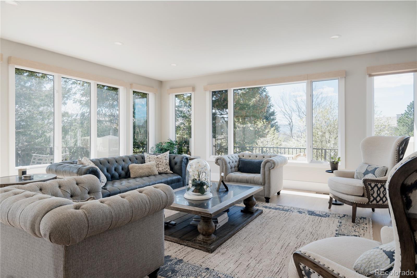 298 Fairchild Drive Highlands Ranch, CO 80126 - Photo 7 of 50 a living room with furniture and a large window