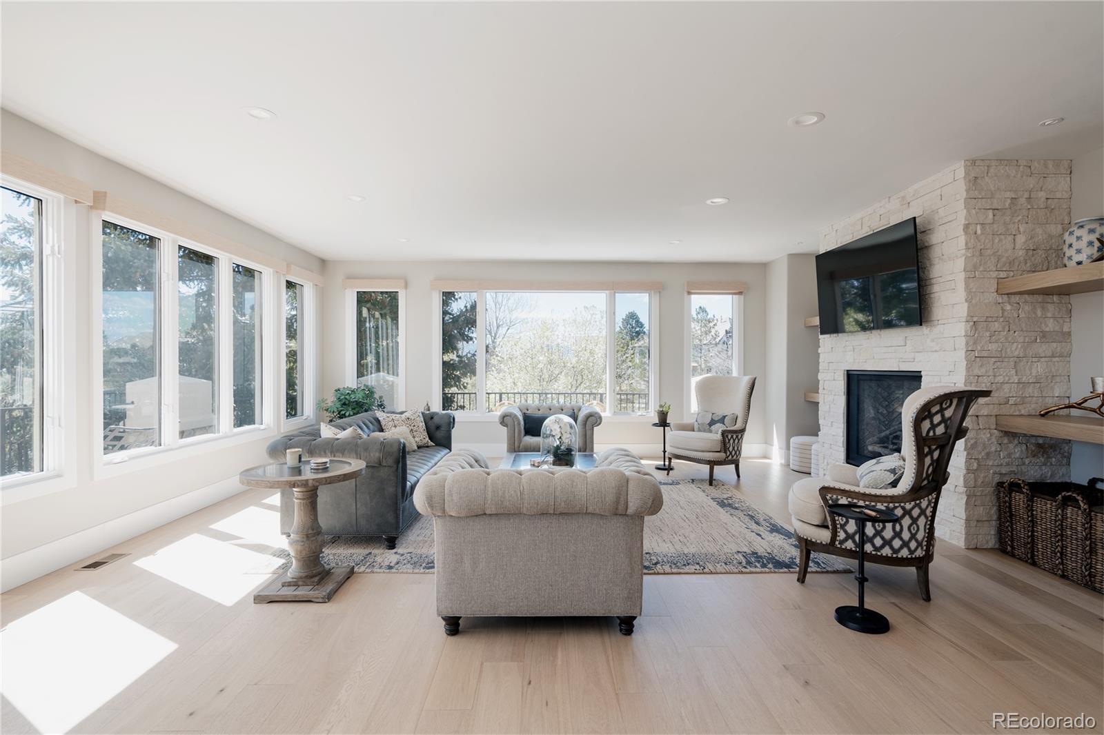 298 Fairchild Drive Highlands Ranch, CO 80126 - Photo 9 of 50 a living room with furniture and a fireplace