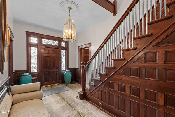 a balcony with furniture and a potted plant