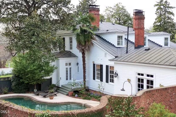 a kitchen with stainless steel appliances kitchen island granite countertop a refrigerator and a stove top oven