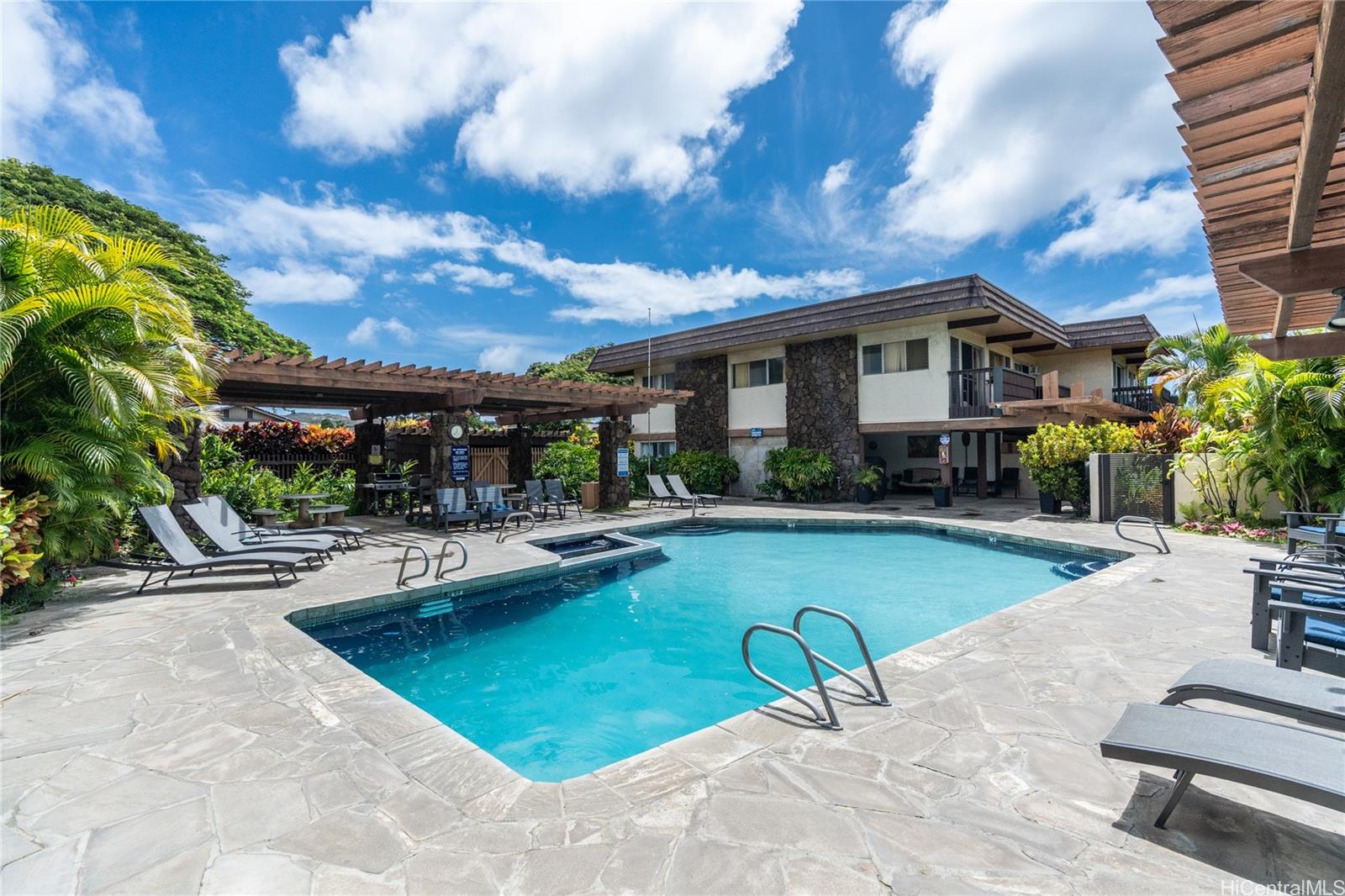 444 Lunalilo Home Road, Unit 506 Honolulu, HI 96825 - Photo 1 of 13 a view of a house with swimming pool and sitting area