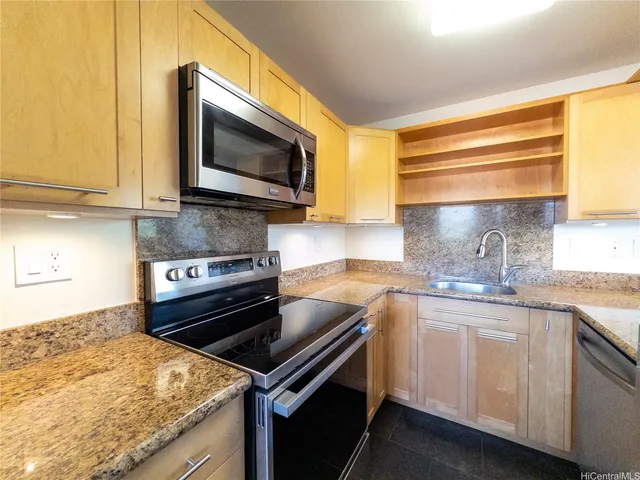 a kitchen with a stove and a microwave