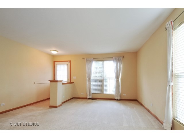 1544 Suncrest Lane Bolingbrook, IL 60490 - Photo 2 of 15 a big room with wooden floor and windows