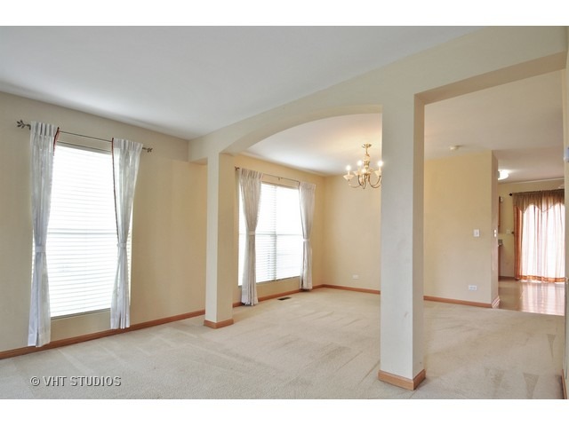 1544 Suncrest Lane Bolingbrook, IL 60490 - Photo 5 of 15 a view of an empty room with wooden floor