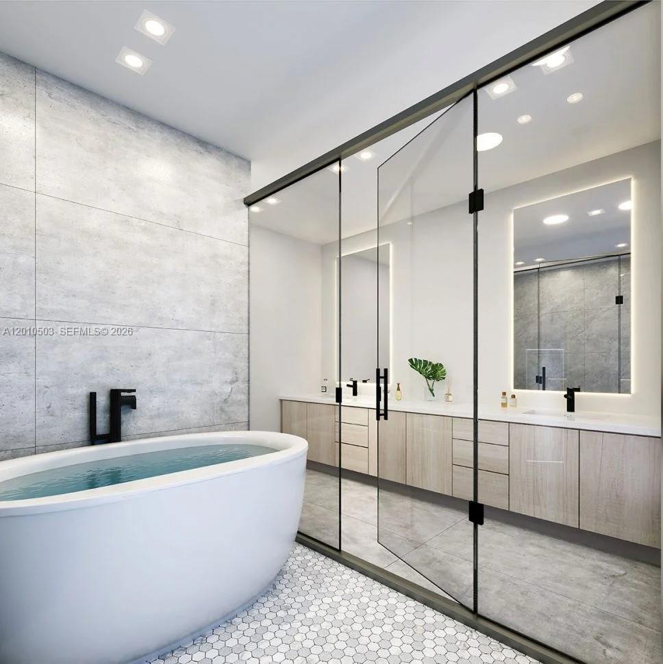 6802 Southwest 80th Street, Unit 6802 Miami, FL 33143 - Photo 3 of 9 a bathroom with a bathtub and a shower
