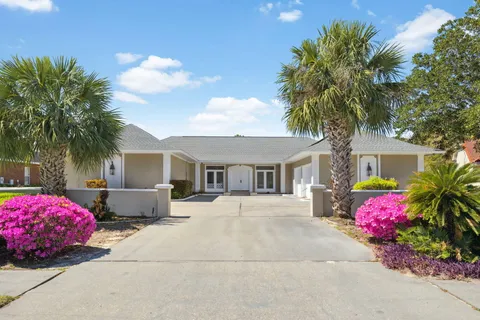 a front view of house with yard and trees