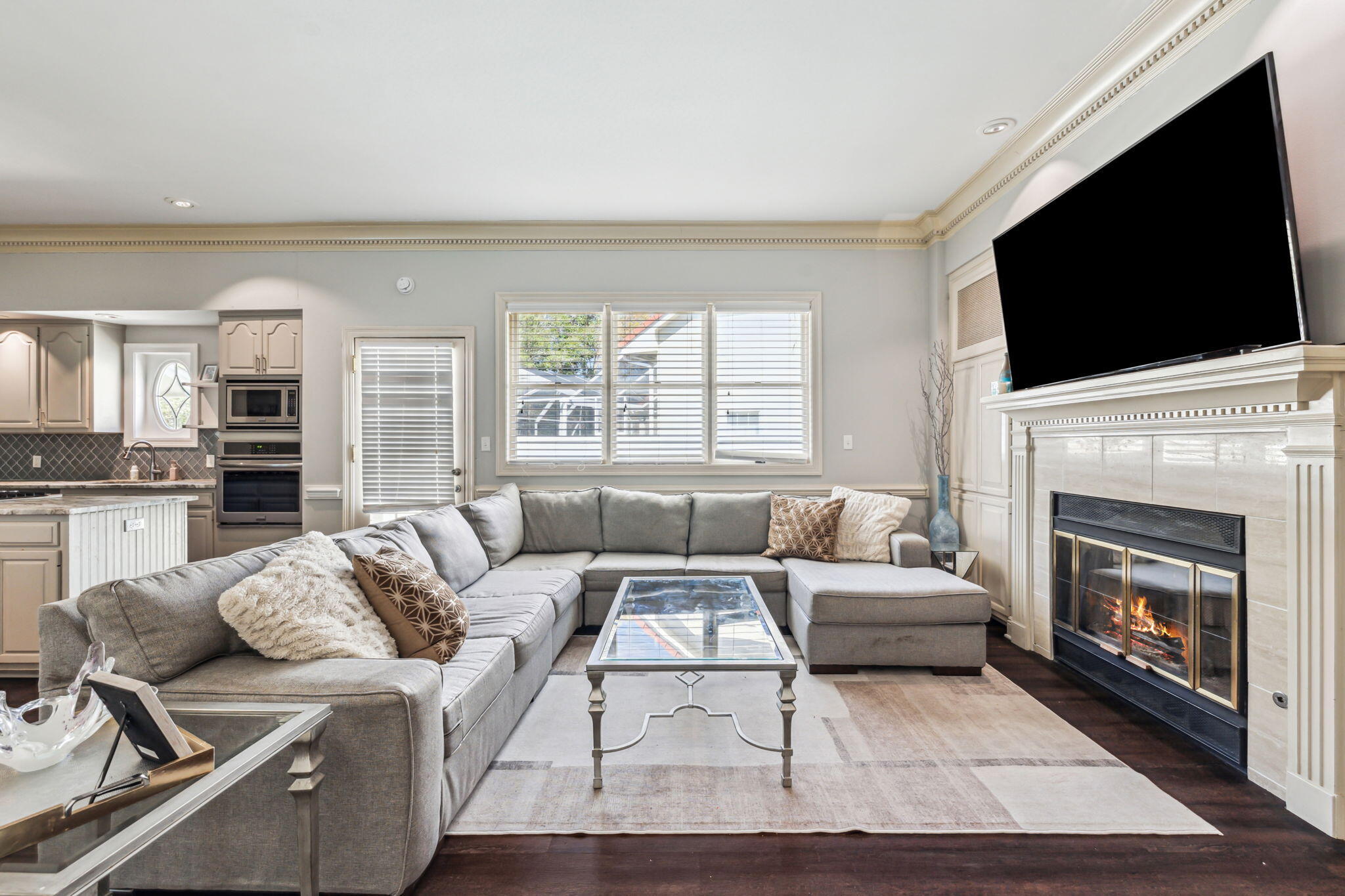 8 Weekewachee Circle Destin, FL 32541 - Photo 11 of 33 a living room with furniture a fireplace and a flat screen tv