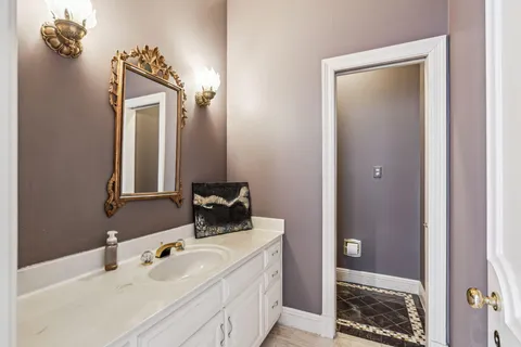 a bathroom with a sink and mirror