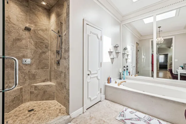 a bathroom with a bathtub and a shower