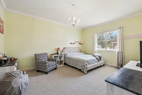 a bathroom with a sink a mirror a toilet and a mirror