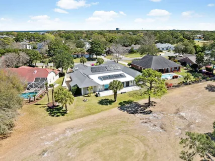 an aerial view of residential houses with outdoor space