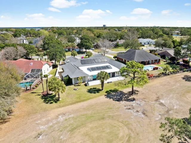an aerial view of residential houses with outdoor space