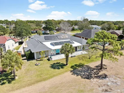 a view of a town with swimming pool and mountains