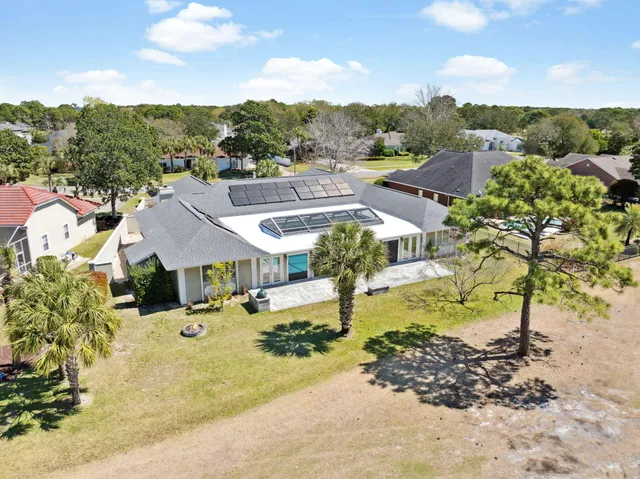 a view of a town with swimming pool and mountains