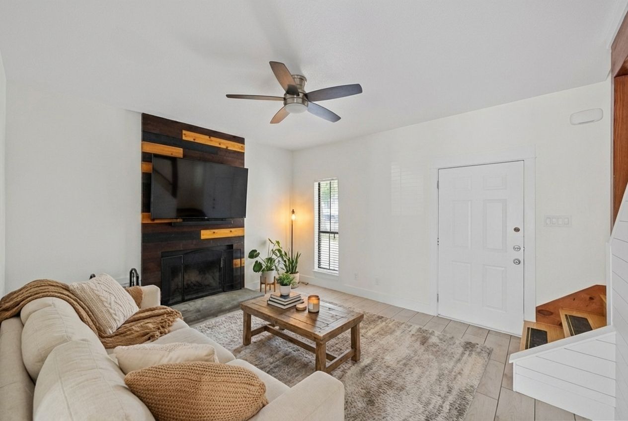 a living room with furniture and a flat screen tv