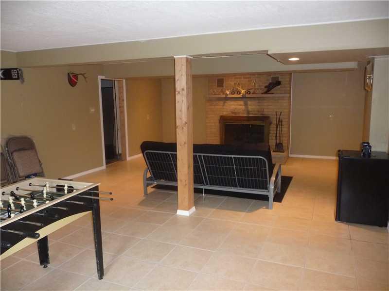 2958 Longview Road Hermitage, PA 16148 - Photo 10 of 12 Family Room. wood burning fireplace and outside entrance