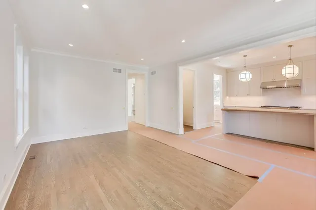 a view of a kitchen with a sink and a window