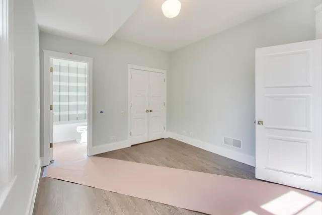 a bathroom with a granite countertop bathtub sink vanity and shower