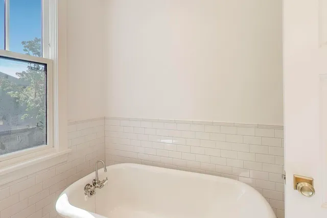 a utility room with sink dryer and washer