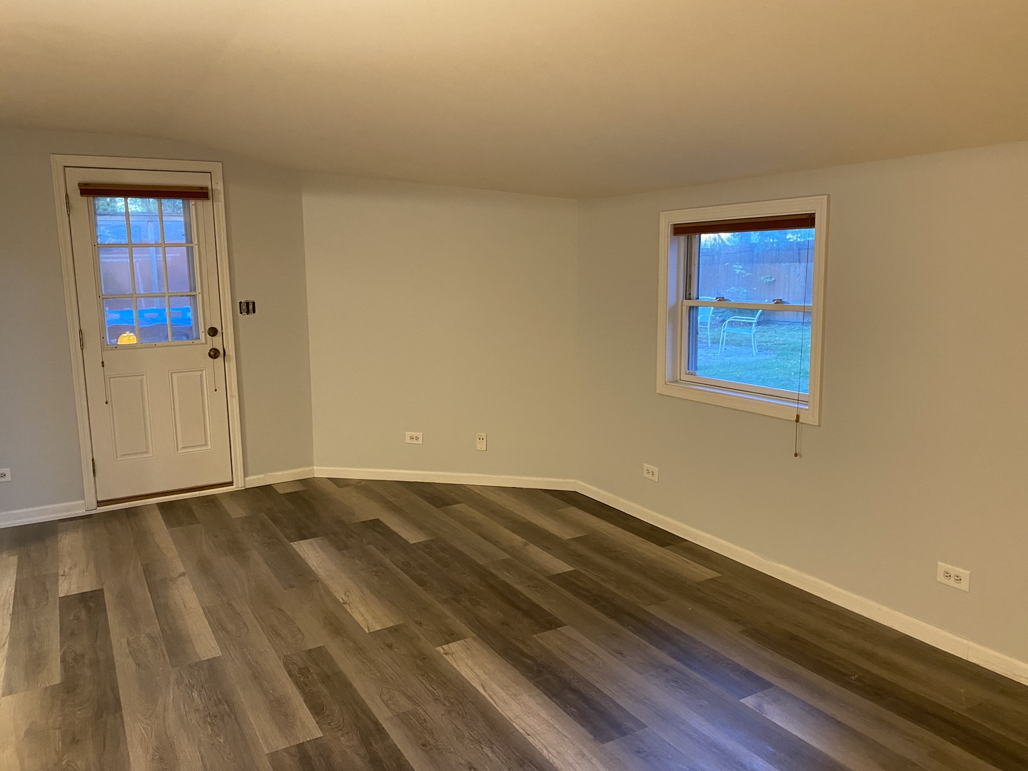 10 Briar Lane Geneva, IL 60134 - Photo 15 of 35 a view of an empty room with wooden floor and a window
