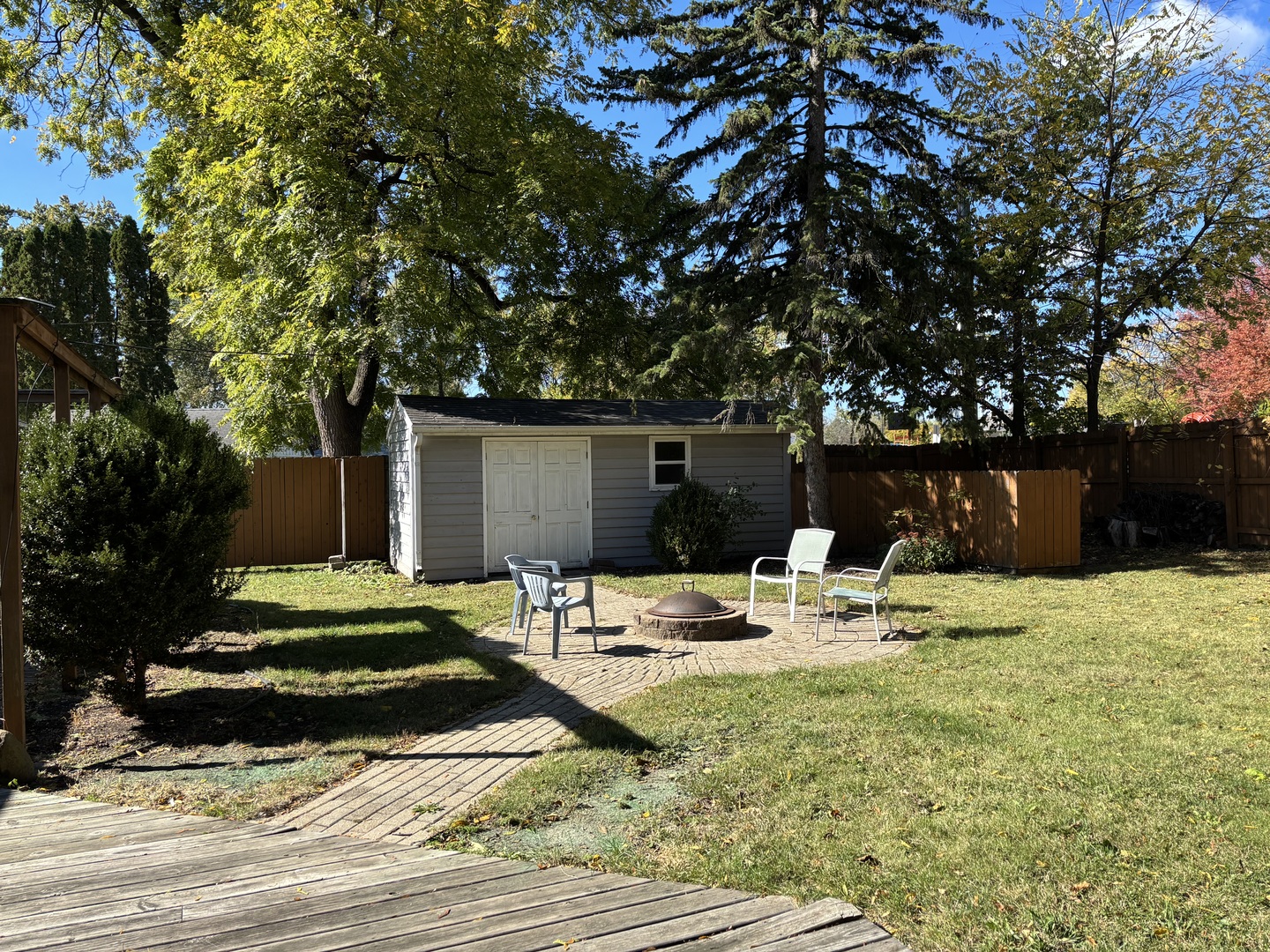 10 Briar Lane Geneva, IL 60134 - Photo 33 of 35 a view of backyard with wooden fence and a large tree