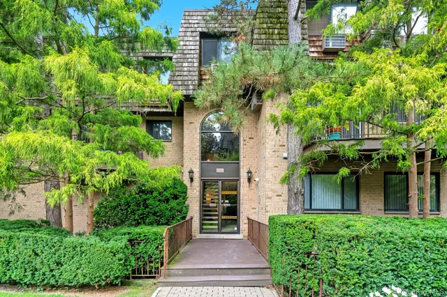front view of a house with a small yard