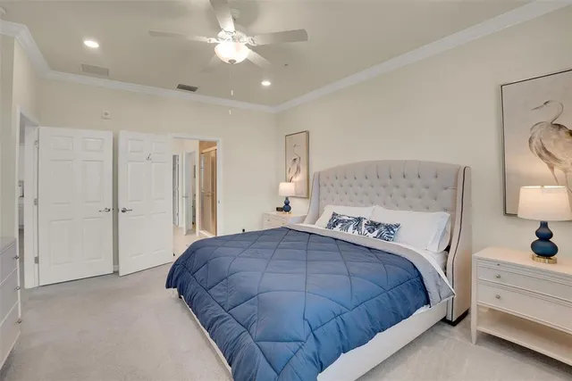 a spacious bathroom with a double vanity sink toilet and shower