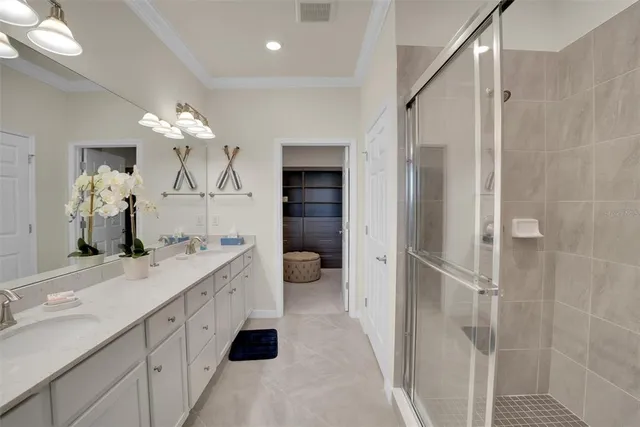 a bathroom with a sink vanity and a mirror