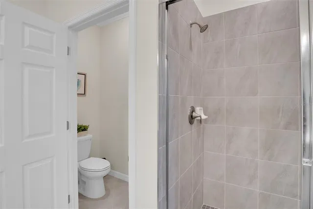 a room with a chair and a fireplace