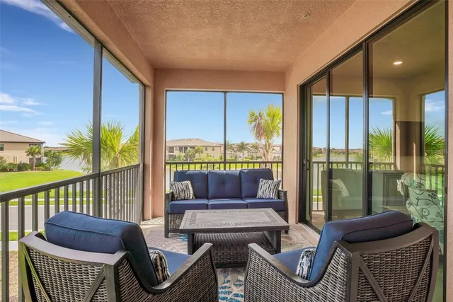 a view of a balcony with a table and chairs