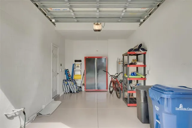 a large white kitchen with a large window