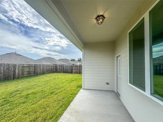 a backyard of a house with lots of green space