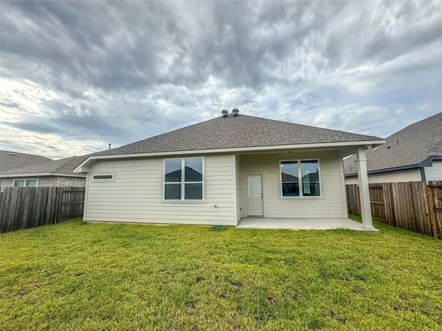 a house with swimming pool in front of it