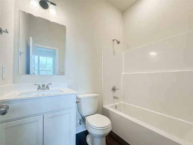 a view of hallway with wooden floor
