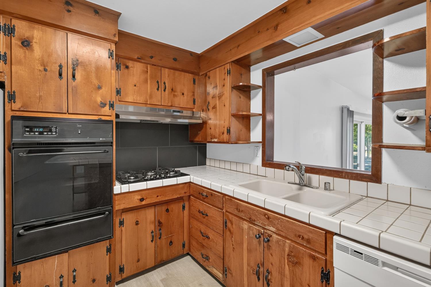 10700 Calvine Road Elk Grove, CA 95830 - Photo 18 of 73 a kitchen with stainless steel appliances granite countertop a sink and a refrigerator