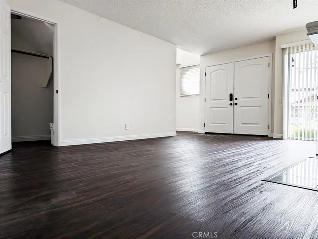 a view of a livingroom with wooden floor