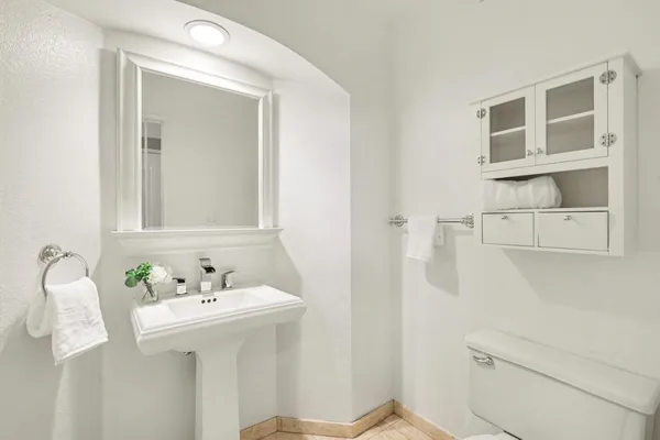 a spacious bathroom with sinks granite and a mirror