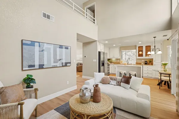 a kitchen with granite countertop a sink a counter space stainless steel appliances and cabinets