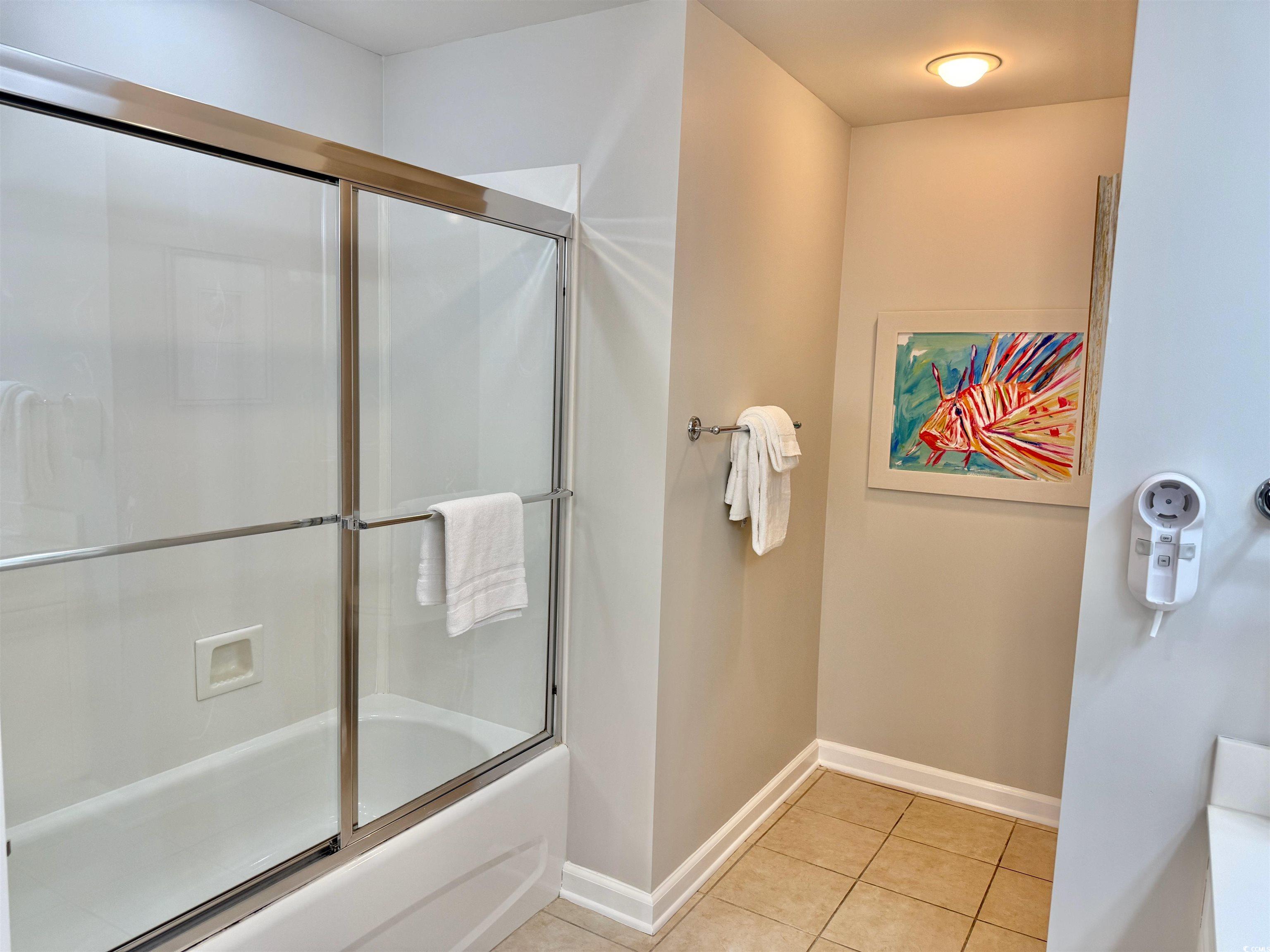 8500 Margate Circle, Unit 1108 Myrtle Beach, SC 29572 - Photo 28 of 40 Full bath featuring combined bath / shower with glass door and light tile patterned floors